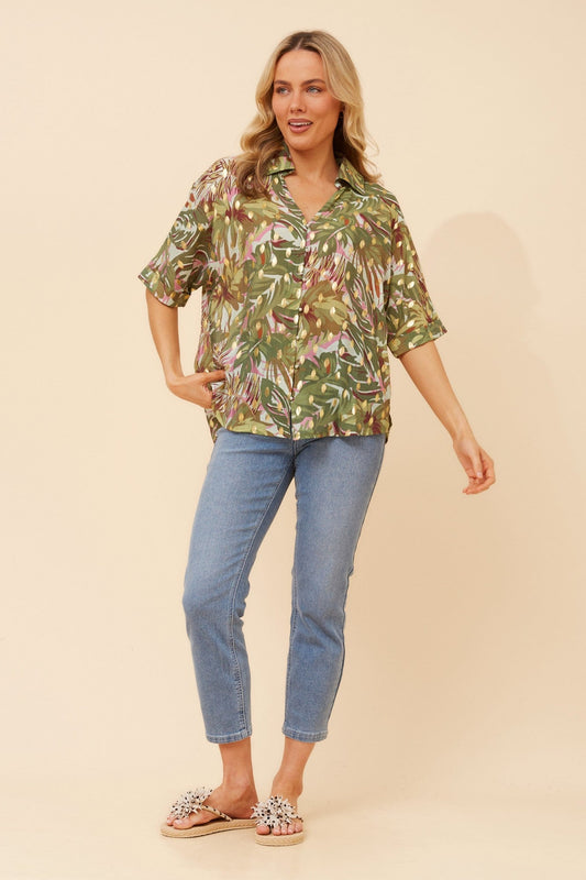 Image of a model wearing Tops. Product name - ZENAIDA FOIL PRINT TOP in Olive colour by brand - Caroline Morgan Australia
