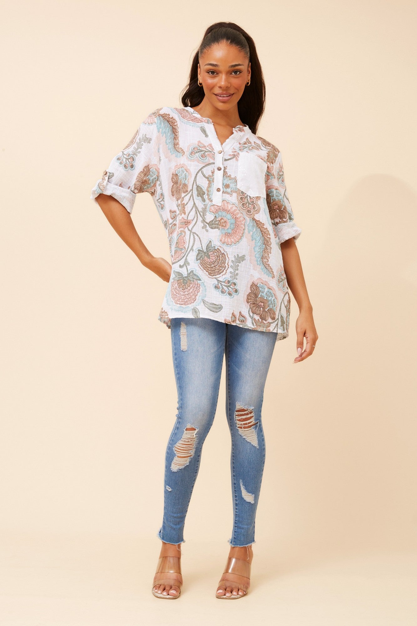 Image of a model wearing Tops. Product name - ROSETTA ABSTRACT PRINT LINEN TOP in Multi White colour by brand - BOTTEGA MODA