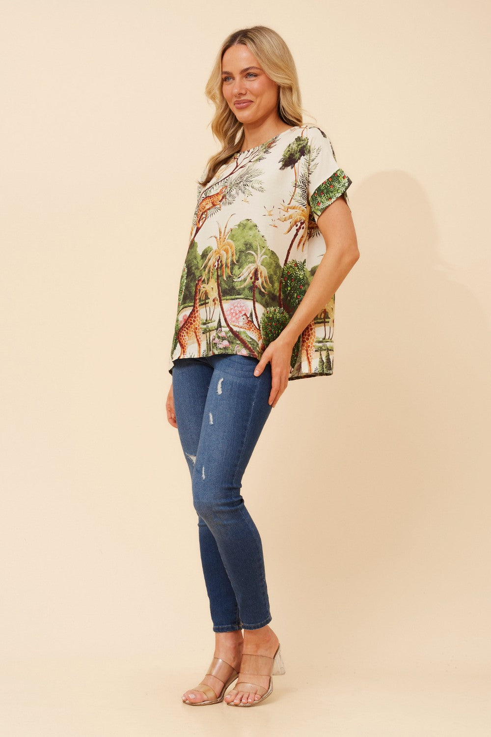Image of a model wearing Tops. Product name - ORSEL ANIMAL PRINT TOP in Multi Cream colour by brand - MYSTIC MONSOON