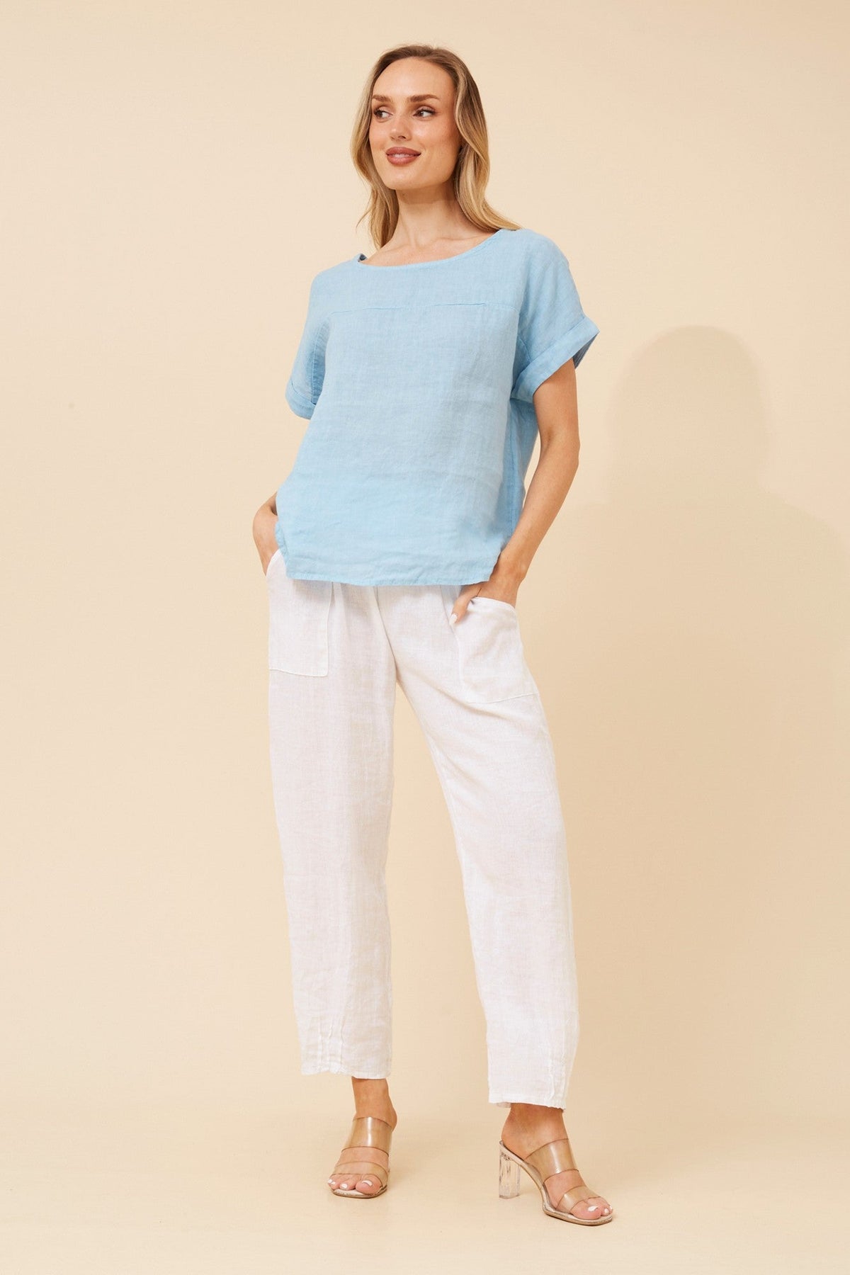 Image of a model wearing Tops. Product name - LEORA SOLID LINEN TOP in Chocolate colour by brand - BOTTEGA MODA