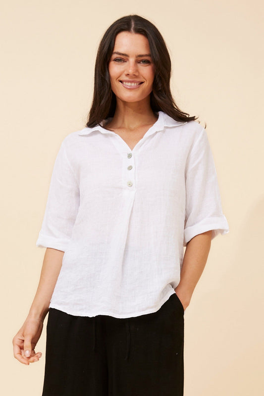 Image of a model wearing Tops. Product name - ARMIDA SOLID LINEN TOP in White colour by brand - BOTTEGA MODA