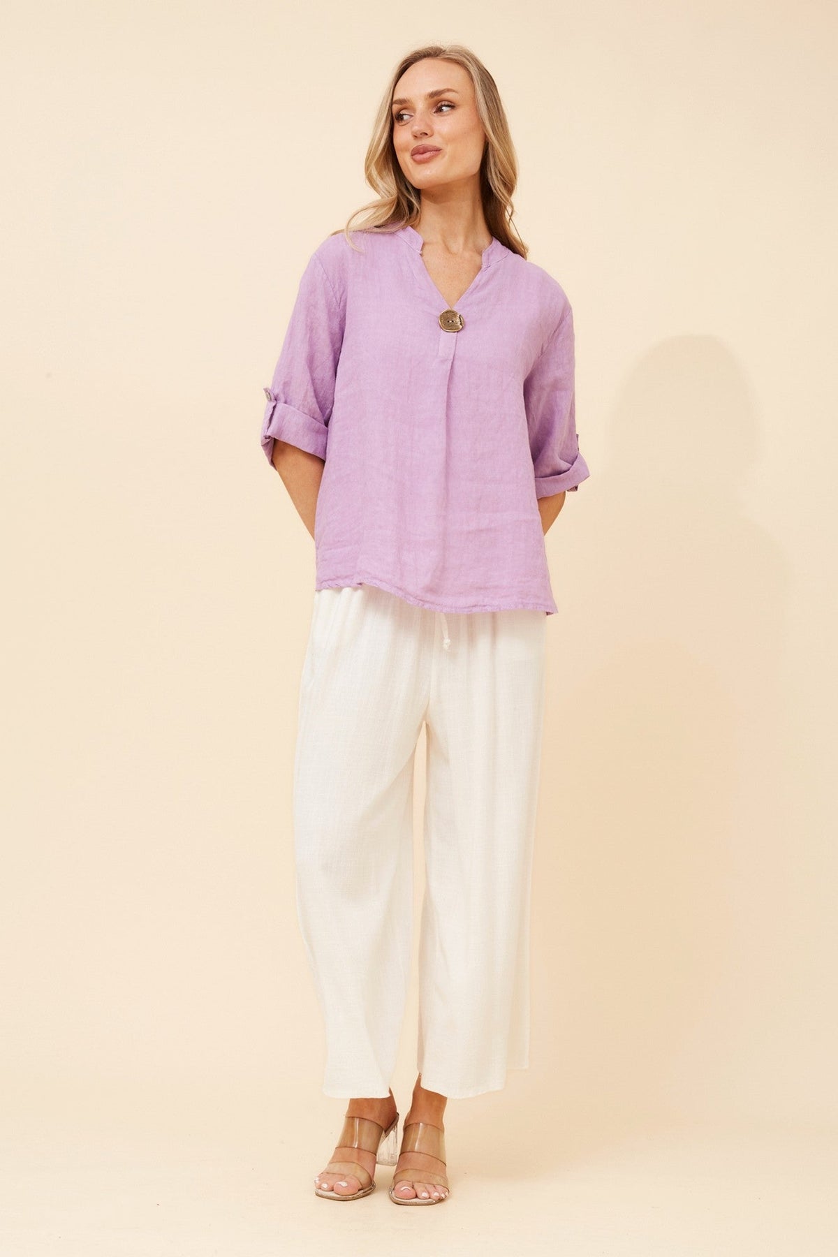 Image of a model wearing Tops. Product name - GREGORIA SOLID LINEN TOP in Bitter Chocolate colour by brand - BOTTEGA MODA