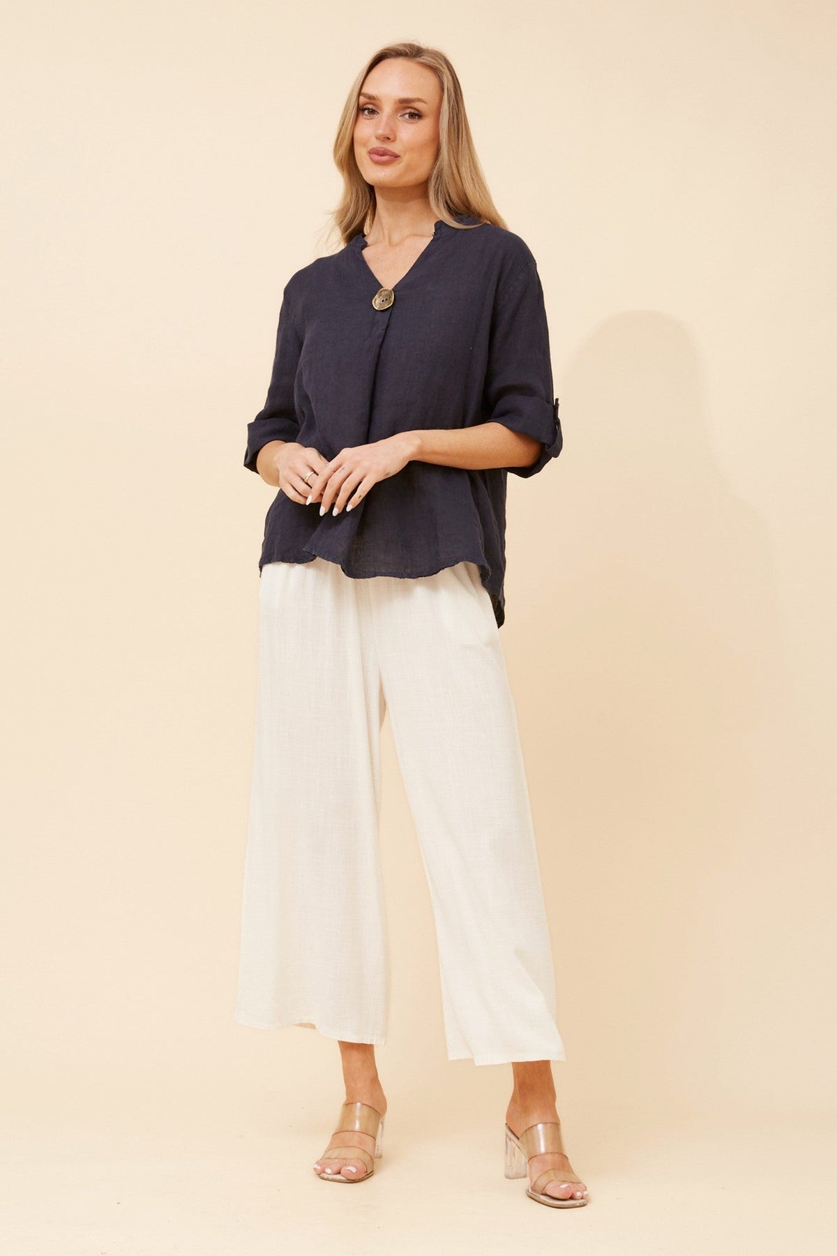 Image of a model wearing Tops. Product name - GREGORIA SOLID LINEN TOP in Navy colour by brand - BOTTEGA MODA