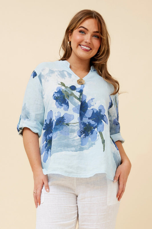 Image of a model wearing Tops. Product name - GREGORIA FLORAL LINEN TOP in Skylight colour by brand - BOTTEGA MODA