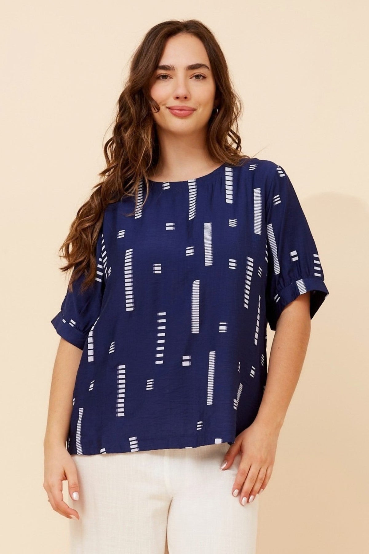 Image of a model wearing Tops. Product name - OSMOND CASUAL TOP in Sage colour by brand - Caroline Morgan Australia