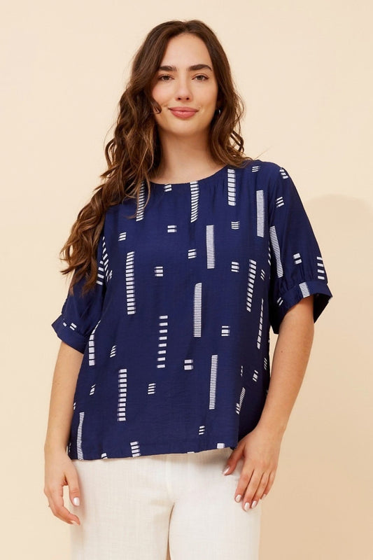 Image of a model wearing Tops. Product name - OSMOND CASUAL TOP in Sage colour by brand - Caroline Morgan Australia