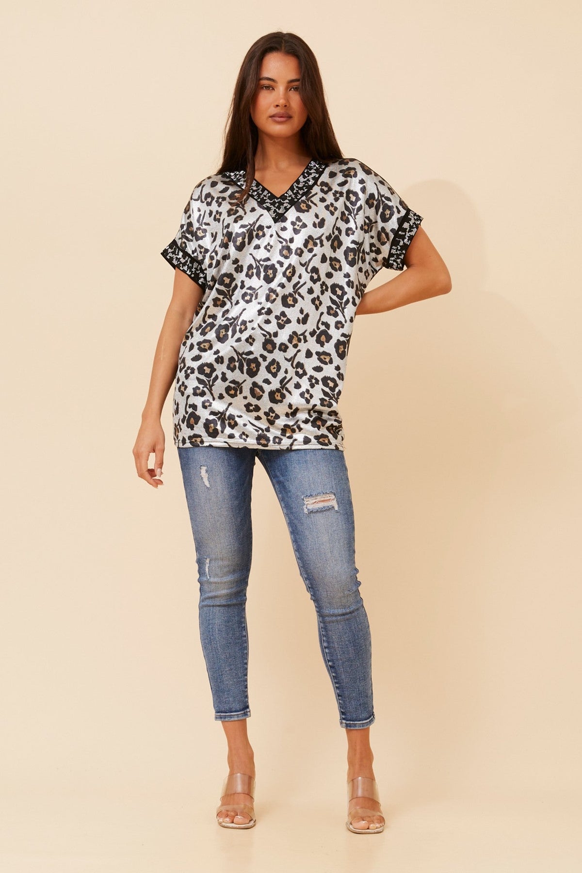 Image of a model wearing Tops. Product name - LUNETTE ANIMAL PRINT TOP in Silver colour by brand - Caroline Morgan Australia