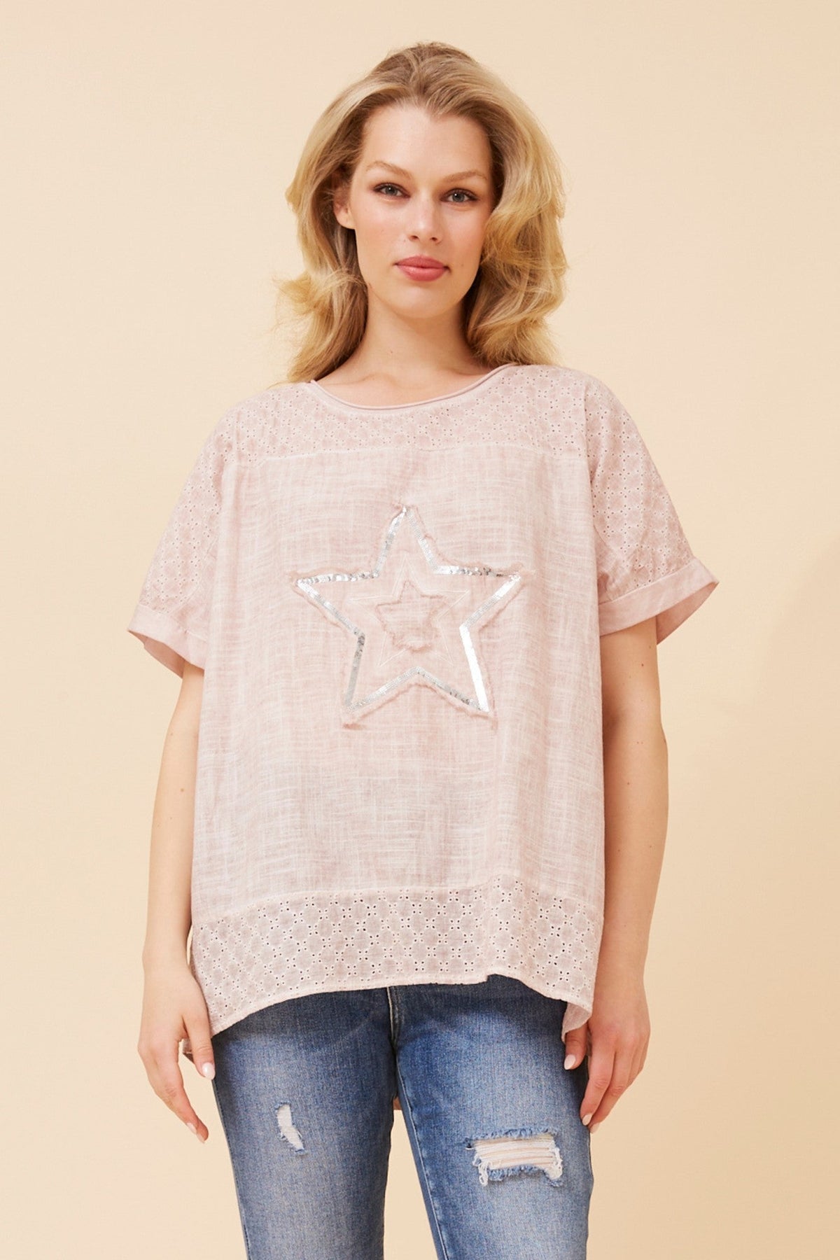 Image of a model wearing Tops. Product name - DRAI SEQUIN STAR TOP in Pink colour by brand - Caroline Morgan Australia