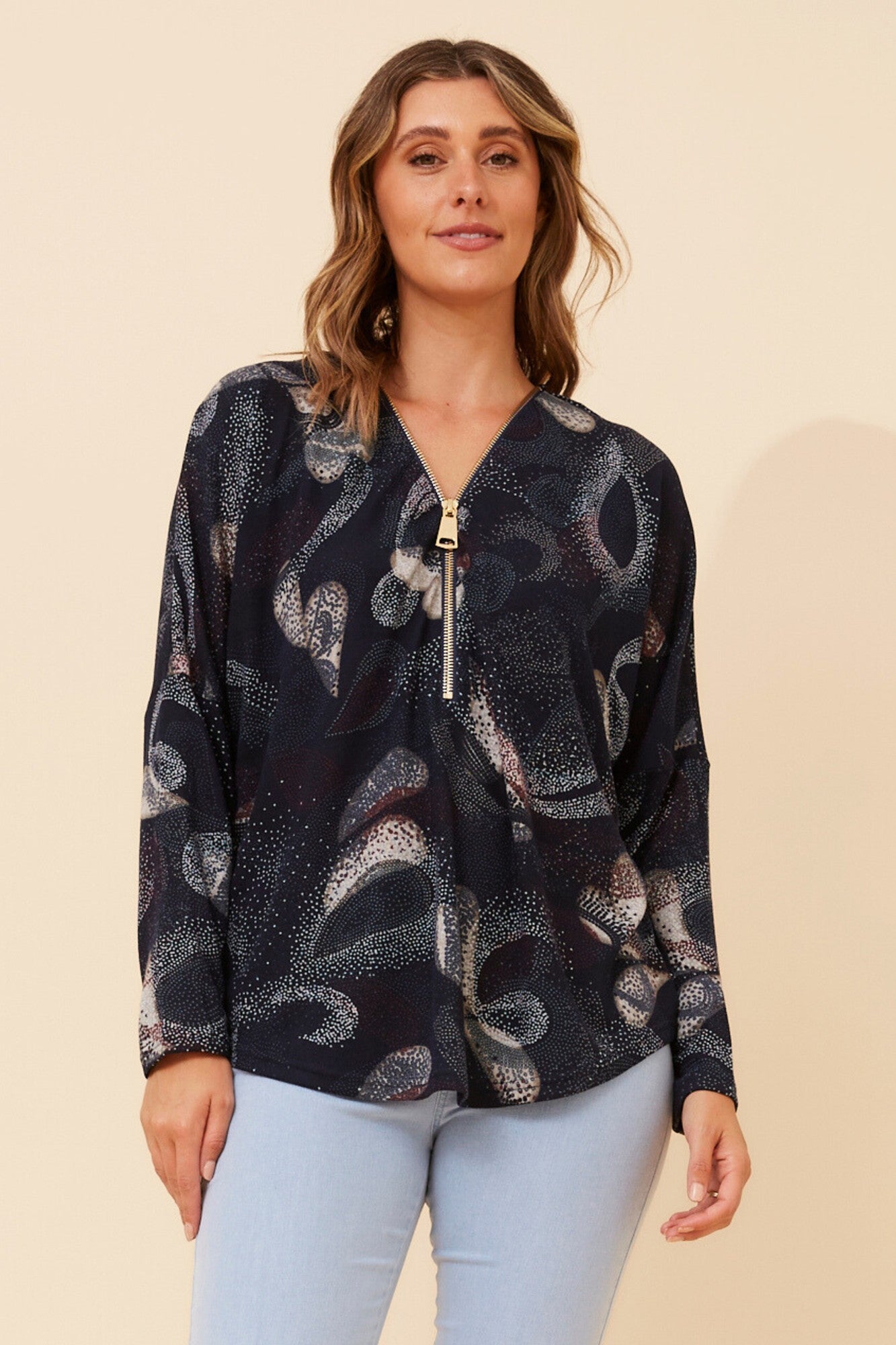 Image of a model wearing Tops. Product name - SUVI ABSTRACT PRINT TOP in Navy colour by brand - Caroline Morgan Australia