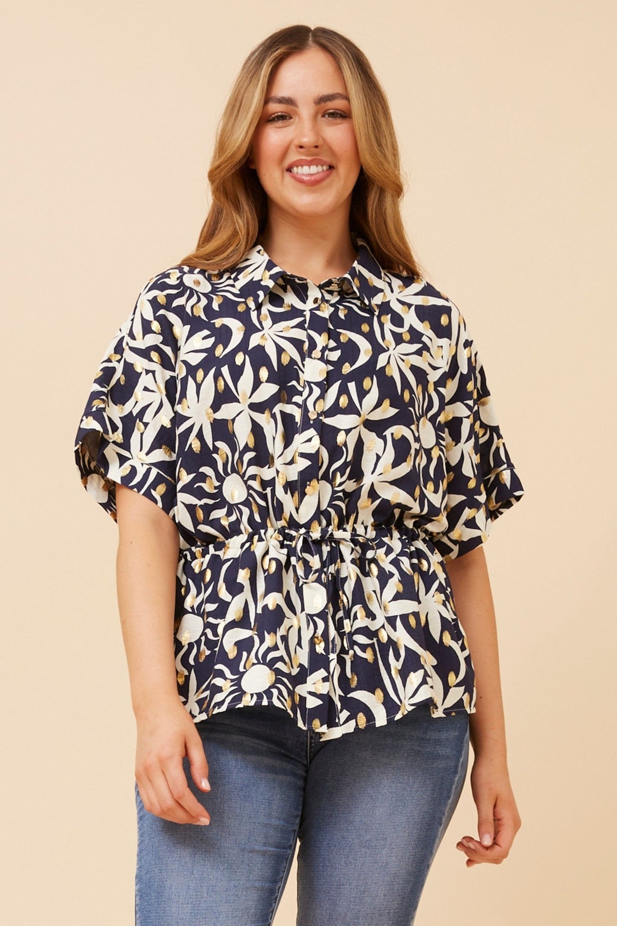 Image of a model wearing Tops. Product name - KAORU FOIL PRINT TOP in Navy colour by brand - Caroline Morgan Australia