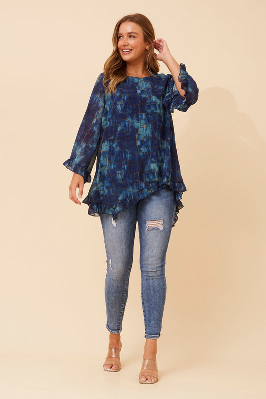 Image of a model wearing Tops. Product name - WANDIN ABSTRACT PRINT TOP in Teal colour by brand - Caroline Morgan Australia