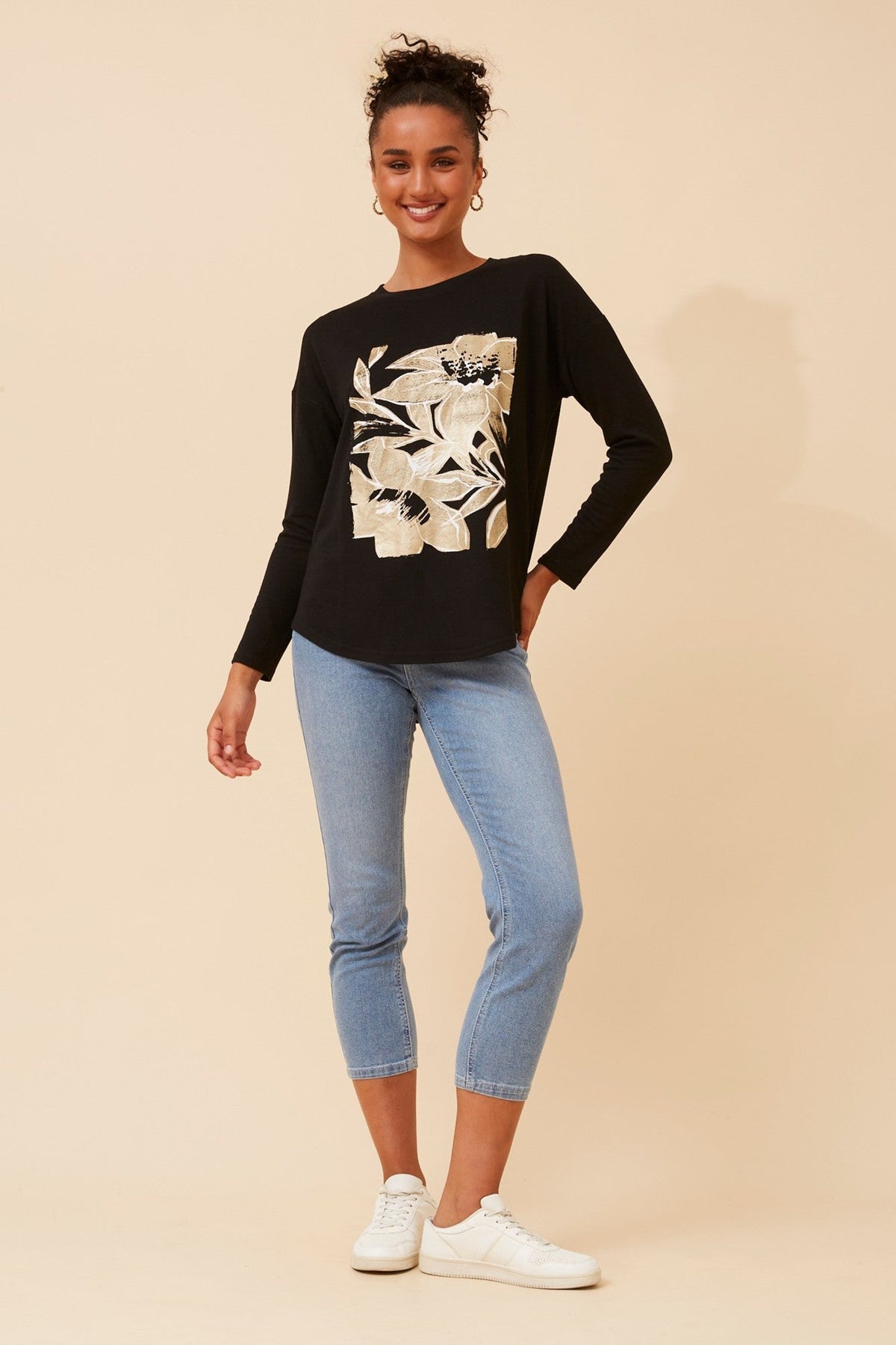 Image of a model wearing Tops. Product name - EVA FOIL PRINT TOP in Black colour by brand - Caroline Morgan Australia
