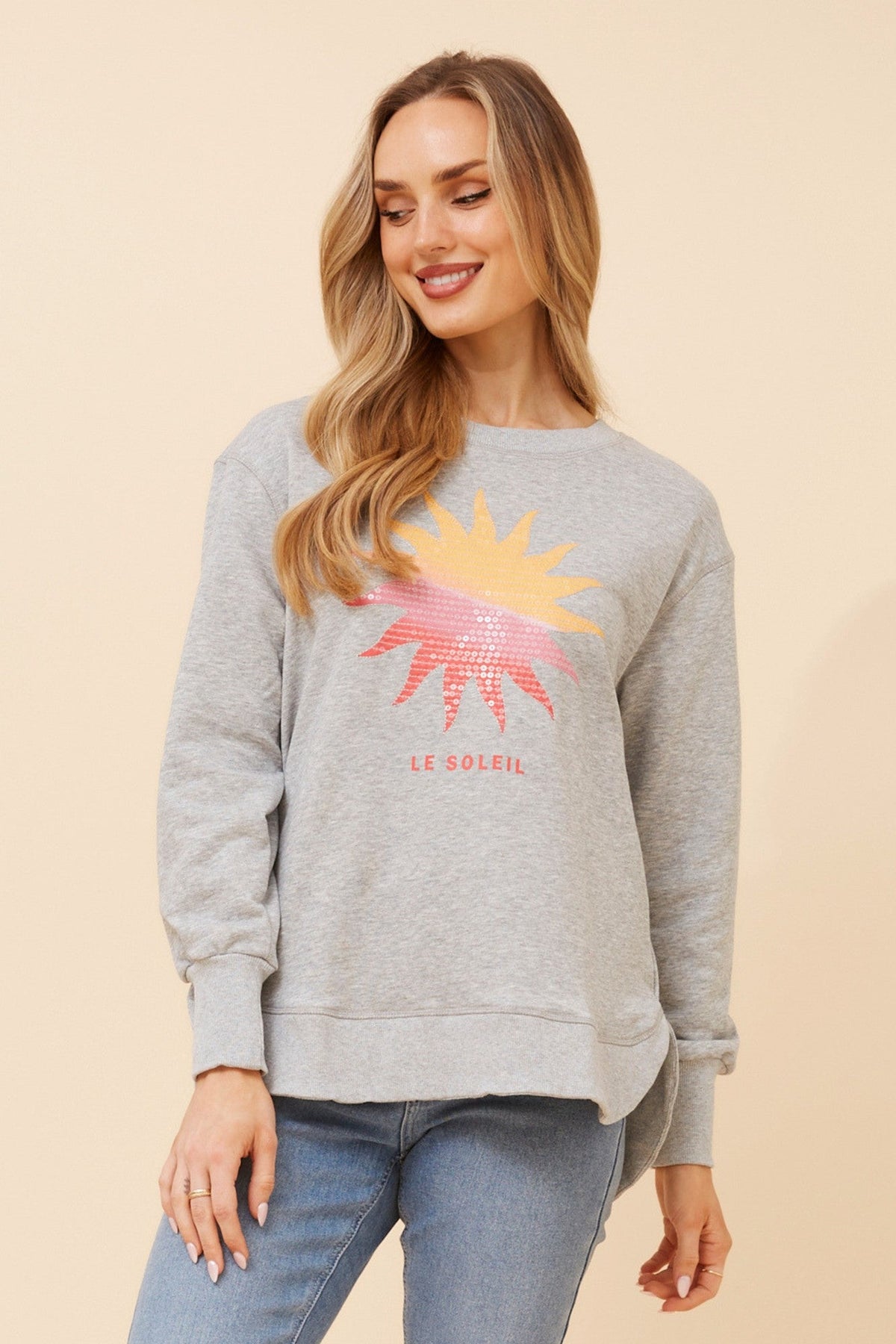 Image of a model wearing Outerwear. Product name - HUDSON GRAPHIC PRINT JUMPER in Light Grey Marl colour by brand - Caroline Morgan Australia