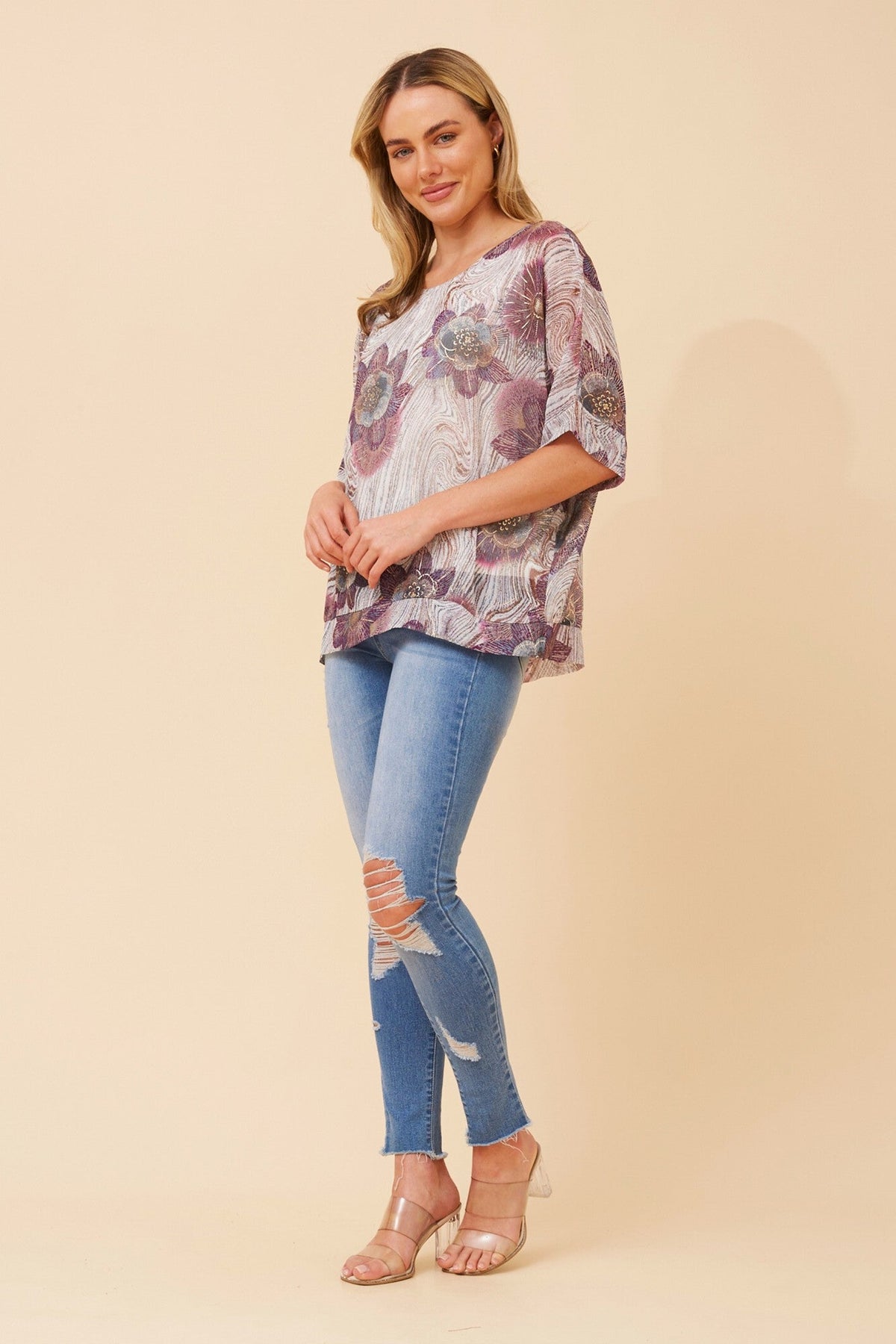 Image of a model wearing Tops. Product name - JACOBA FLORAL PRINT TOP in Multi Teal colour by brand - Caroline Morgan Australia