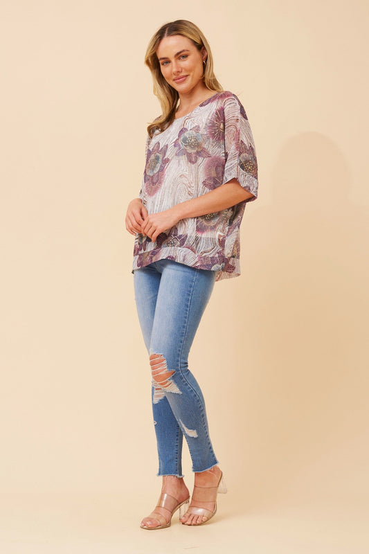 Image of a model wearing Tops. Product name - JACOBA FLORAL PRINT TOP in Multi Teal colour by brand - Caroline Morgan Australia