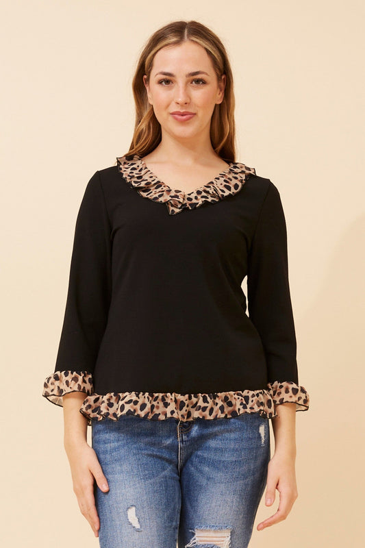 Image of a model wearing Tops. Product name - LUNETTA ANIMAL PRINT FRILL TOP in Black colour by brand - Caroline Morgan Australia