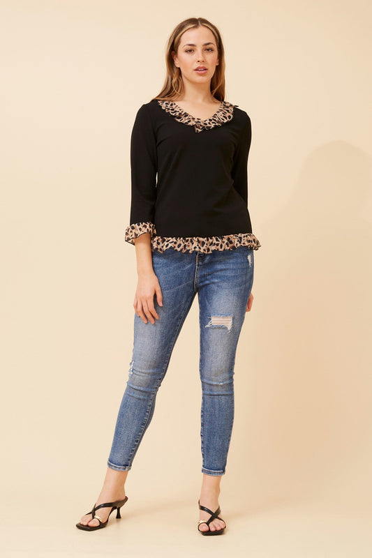 Image of a model wearing Tops. Product name - LUNETTA ANIMAL PRINT FRILL TOP in Black colour by brand - Caroline Morgan Australia