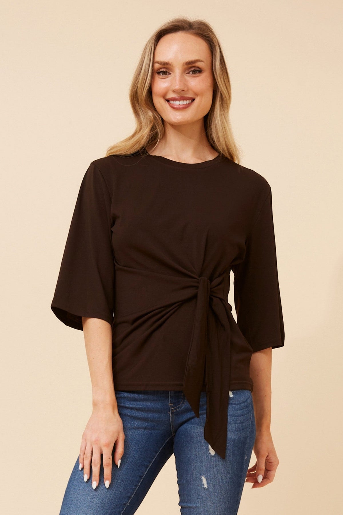 Image of a model wearing Tops. Product name - WAILANI SOLID TOP in Bitter Chocolate colour by brand - Caroline Morgan Australia