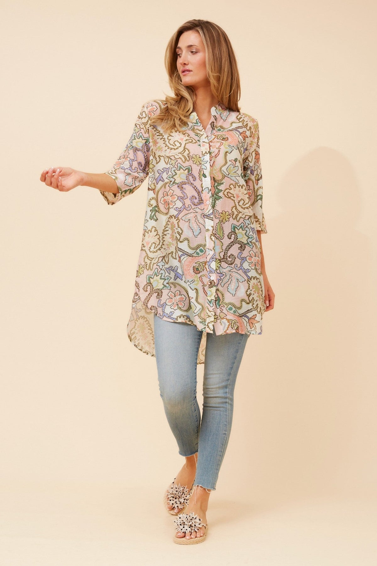Image of a model wearing Outerwear. Product name - DANSON ABSTRACT PRINT TUNIC TOP in Multi Pink colour by brand - Caroline Morgan Australia
