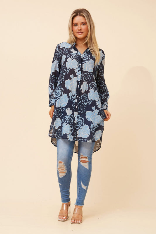 Image of a model wearing Outerwear. Product name - JANSON FLORAL TUNIC SHIRT in Navy colour by brand - Caroline Morgan Australia