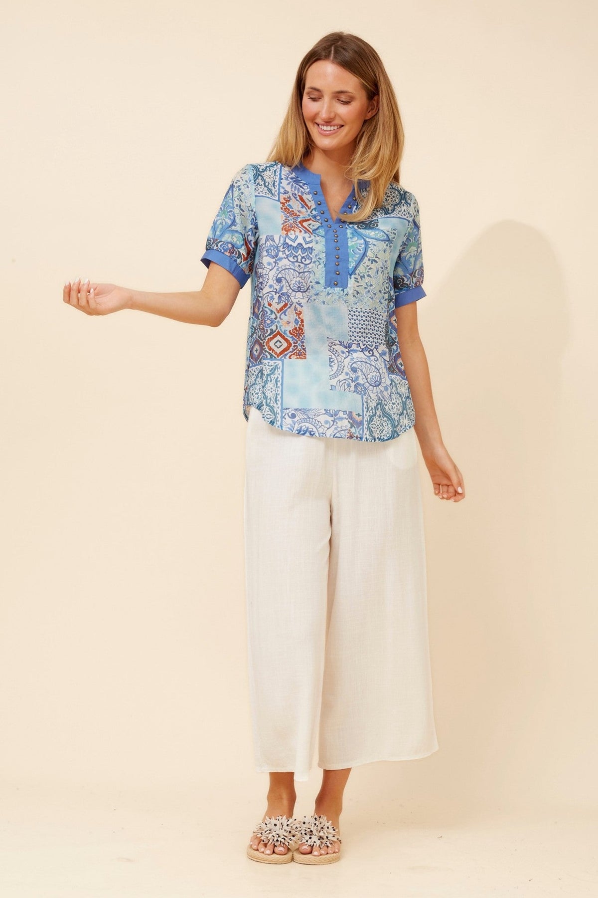 Image of a model wearing Tops. Product name - ARCHELLE ABSTRACT PRINT TOP in Skylight colour by brand - Caroline Morgan Australia