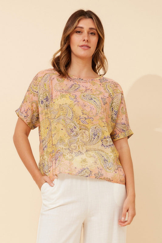 Image of a model wearing Tops. Product name - HENDRIX PAISLEY PRINT TOP in Multi Pink colour by brand - Caroline Morgan Australia