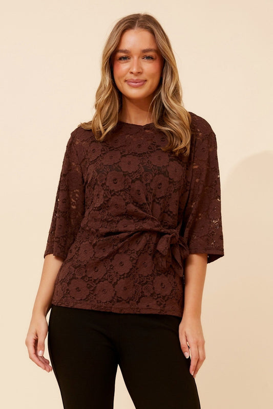 Image of a model wearing Tops. Product name - WAILANI LACE TOP in Chocolate colour by brand - Caroline Morgan Australia