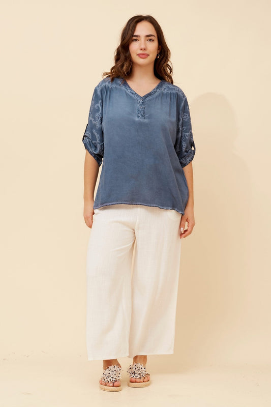 Image of a model wearing Tops. Product name - ROHAN EMBROIDERY TOP in Beige colour by brand - BOTTEGA MODA