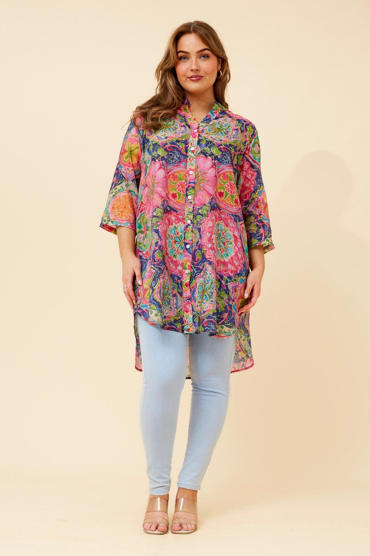 Image of a model wearing Outerwear. Product name - DANSON FLORAL TUNIC in Multi Pink colour by brand - Caroline Morgan Australia