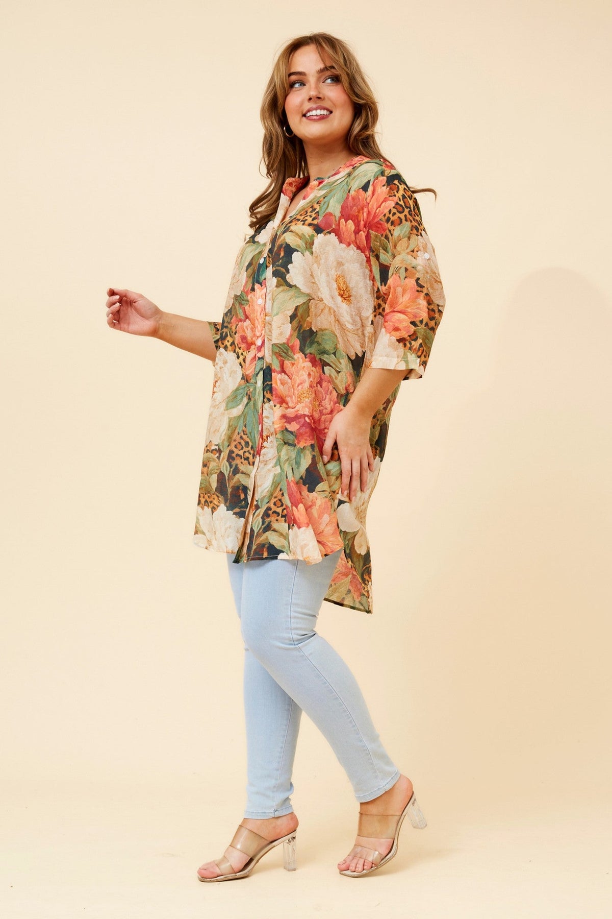 Image of a model wearing Outerwear. Product name - DANSON ANIMAL PRINT TUNIC in Multi Orange colour by brand - Caroline Morgan Australia