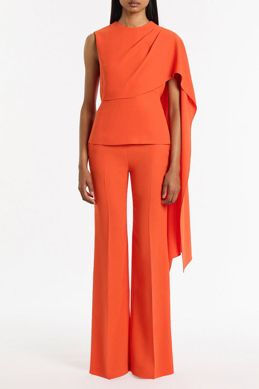 Image of a model wearing Tops. Product name - Tangerine Crepe Cascade Top in Orange colour by brand - Carla Zampatti