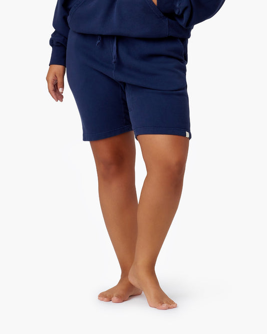 Image of a model wearing Shorts. Productname: Core Short Navy in Navy colour by brand - TKEES