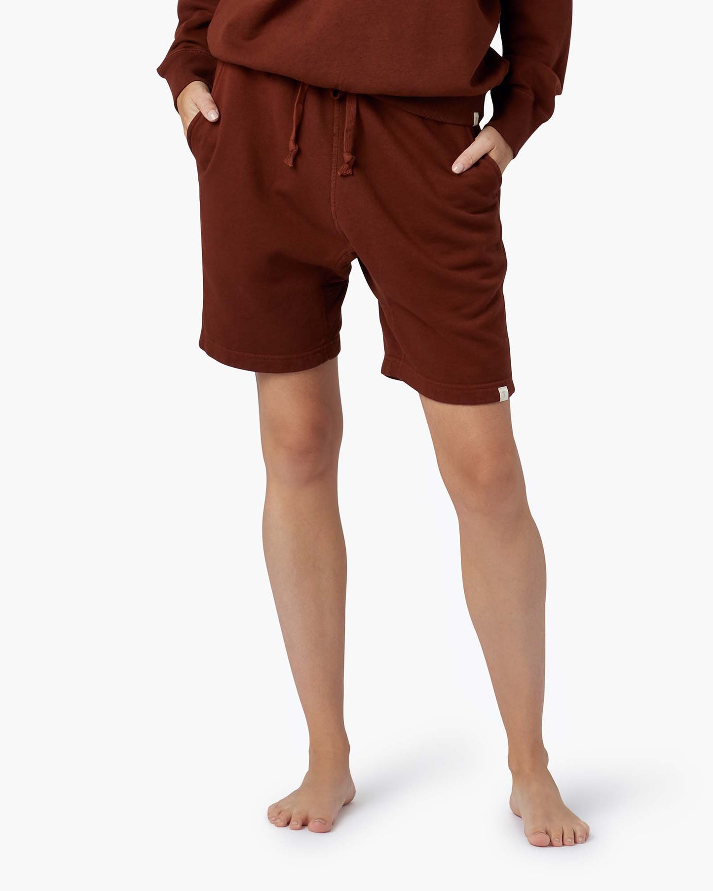 Image of a model wearing Shorts. Productname: Core Short Tannin in Tannin colour by brand - TKEES