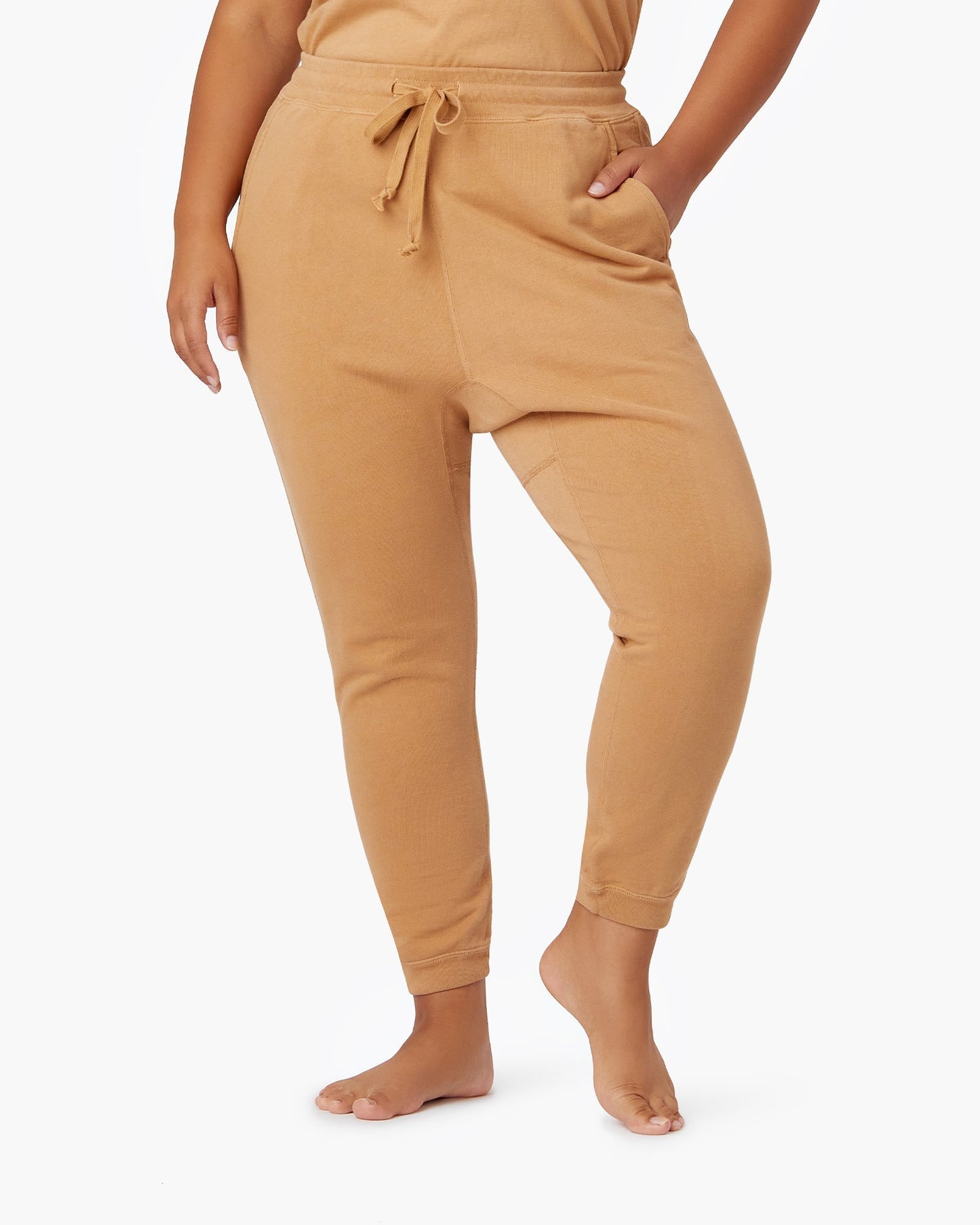 Image of a model wearing Pants. Productname: Core Jogger Toast in Toast colour by brand - TKEES