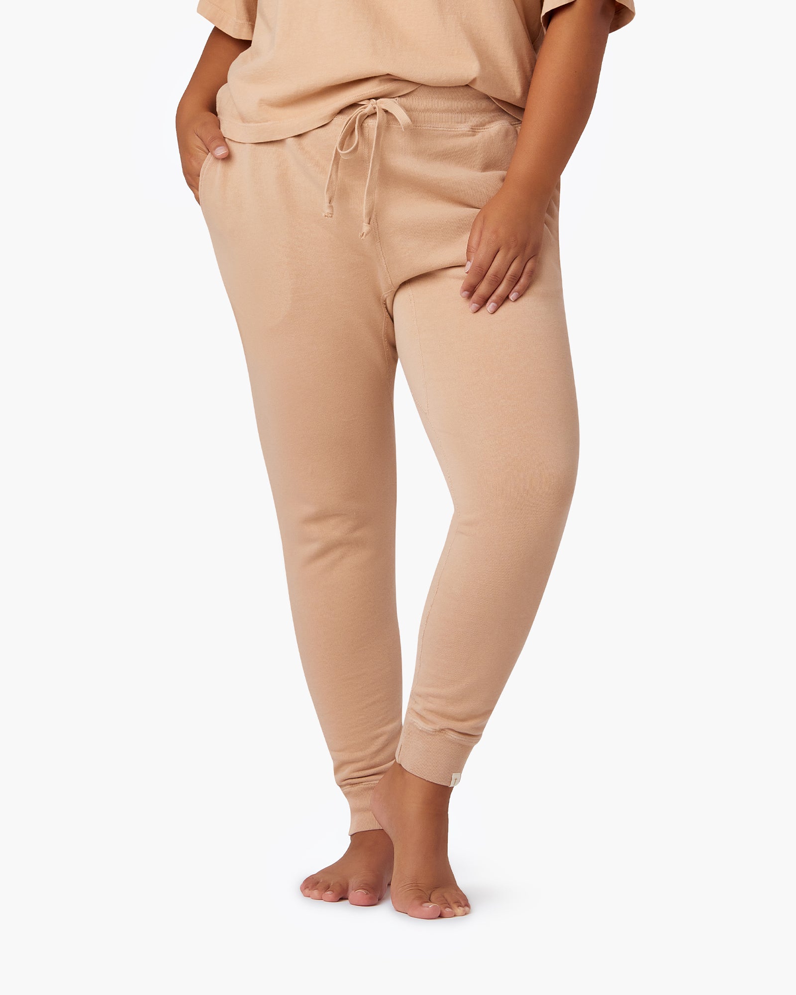 Image of a model wearing Pants. Productname: Core Sport Jogger Bisque in Bisque colour by brand - TKEES