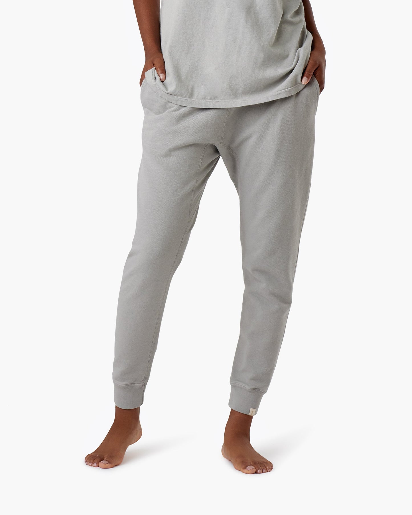 Image of a model wearing Pants. Productname: Core Sport Jogger Dove in Dove colour by brand - TKEES