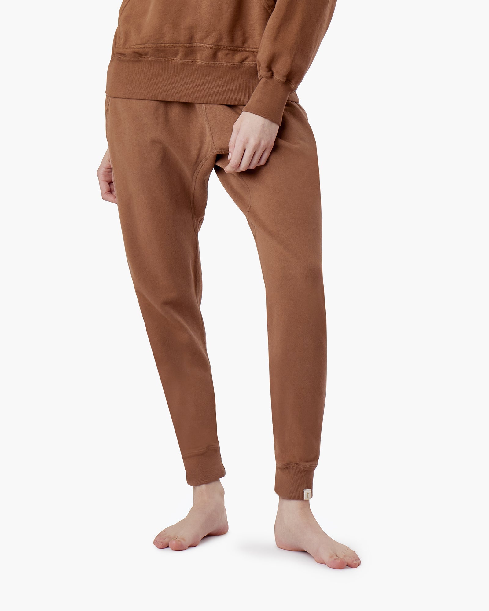 Image of a model wearing Pants. Productname: Core Sport Jogger Nutmeg in Nutmeg colour by brand - TKEES