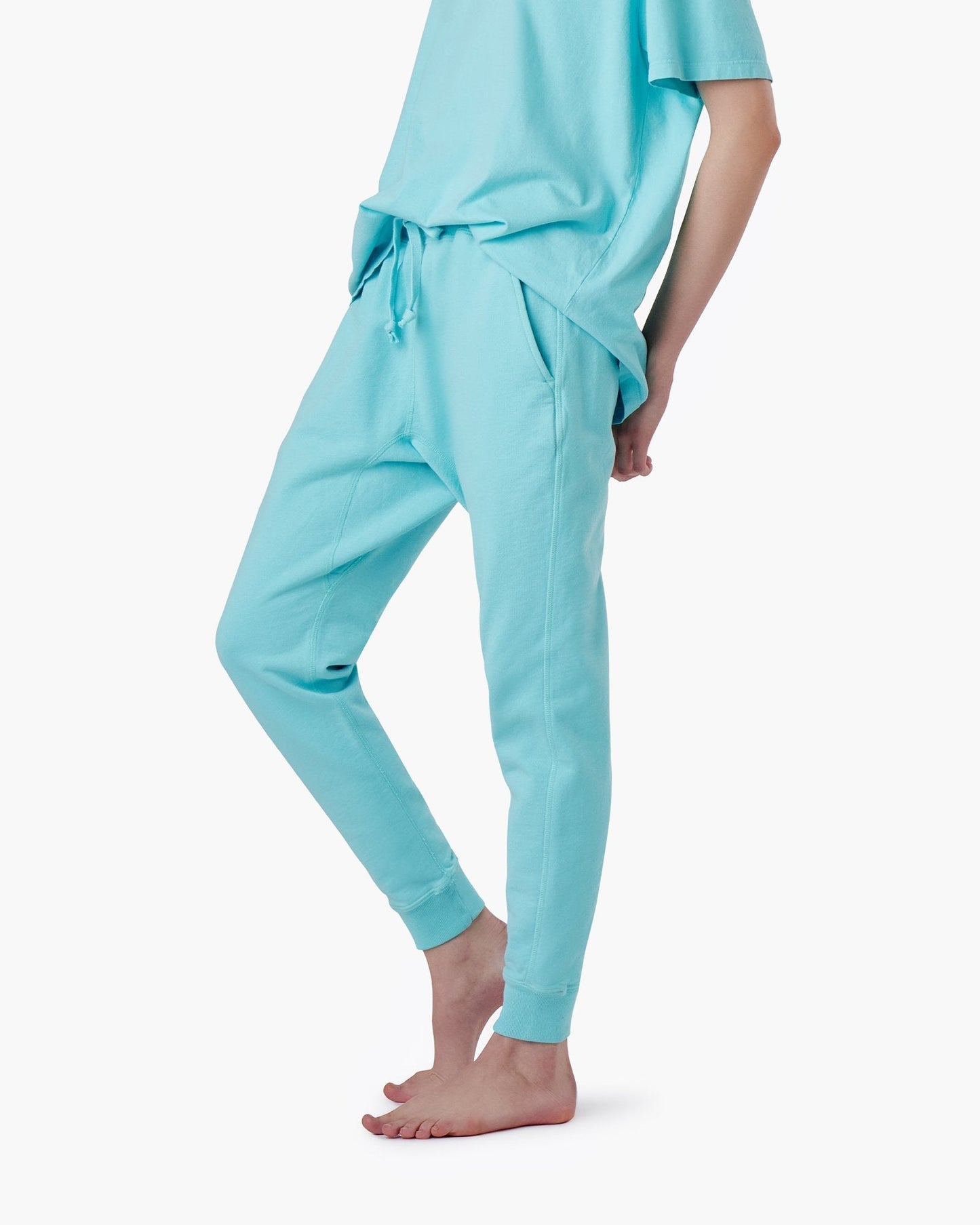 Image of a model wearing Pants. Productname: Core Sport Jogger Sky Blue in Sky Blue colour by brand - TKEES