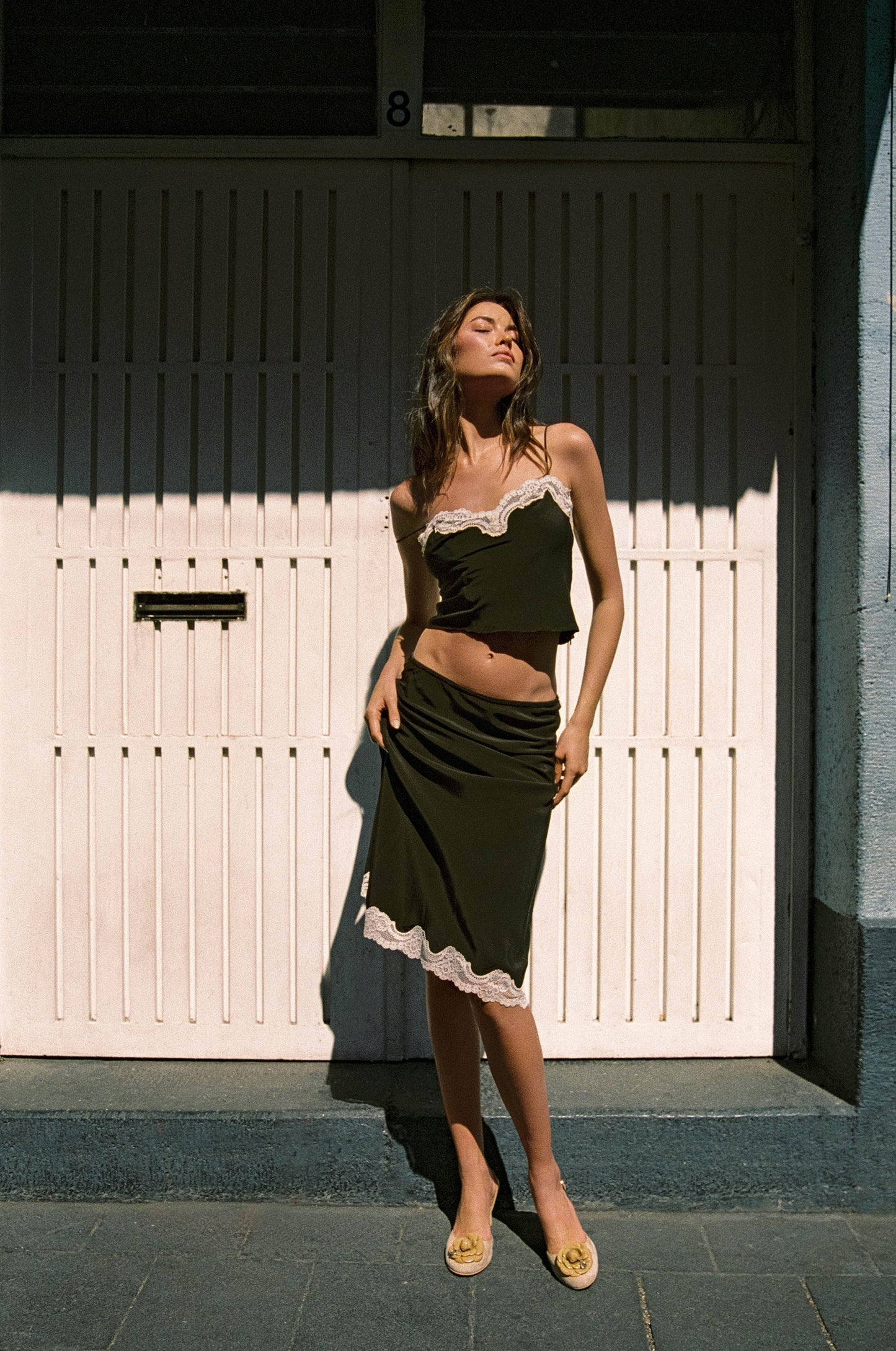 Image of a model wearing Skirts. Product name - Tilly Skirt in Chocolate colour by brand - With Jéan