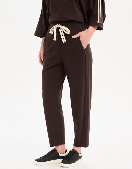 Image of a model wearing Pants. Product name - Barrel Leg Lounge Pant Chocolate / Cream Stripe in Chocolate / Cream Stripe colour by brand - Tirelli