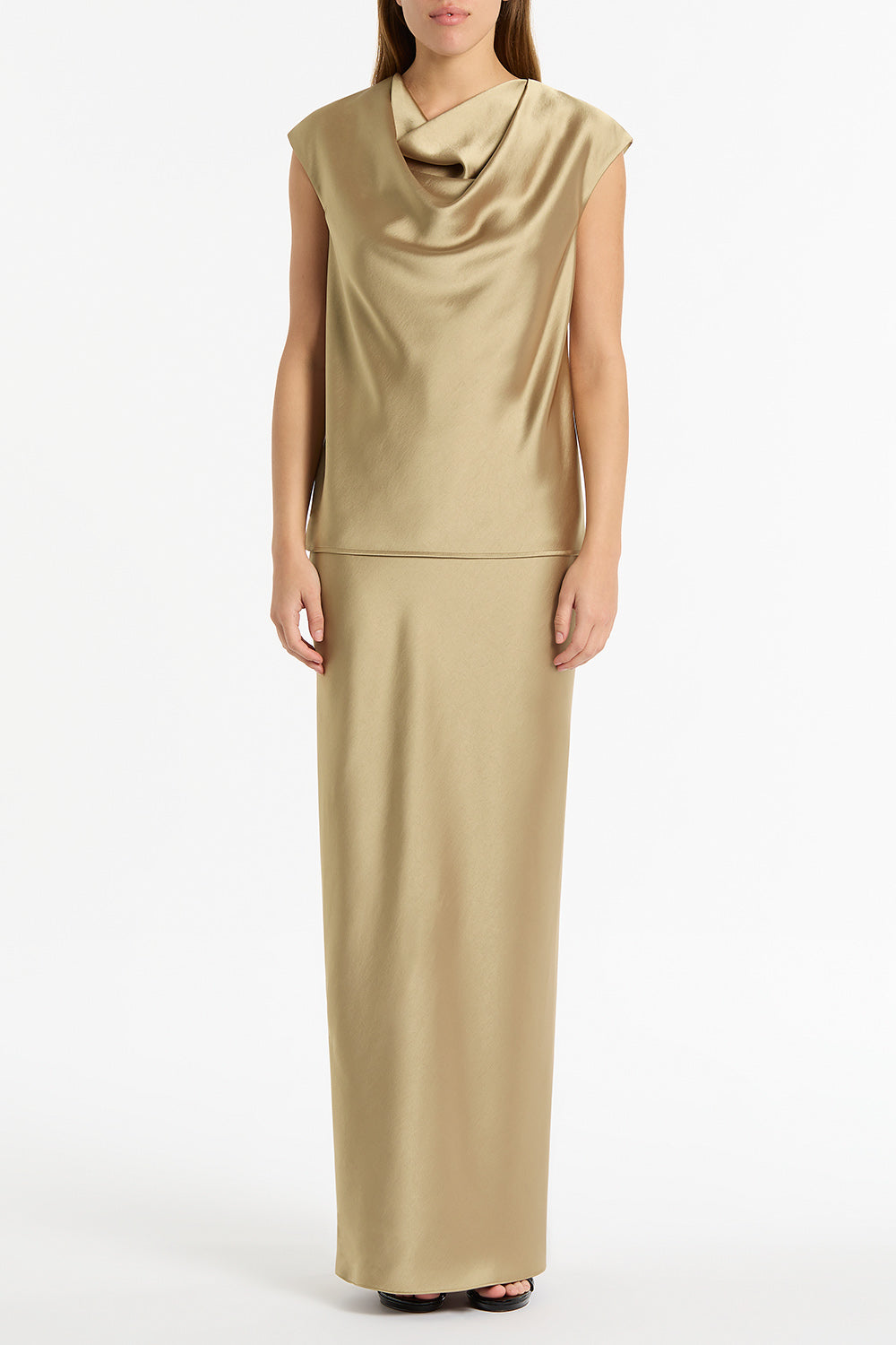 Image of a model wearing Skirts. Product name - Tourmaline Satin Bias Skirt in Gold colour by brand - Carla Zampatti