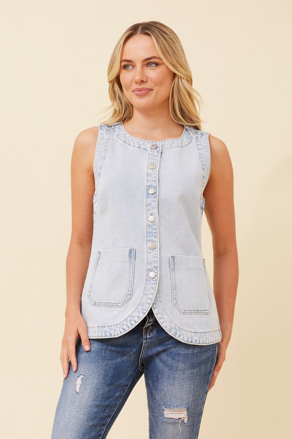 Image of a model wearing Outerwear. Product name - YUSUF DENIM VEST in Light Denim colour by brand - Caroline Morgan Australia