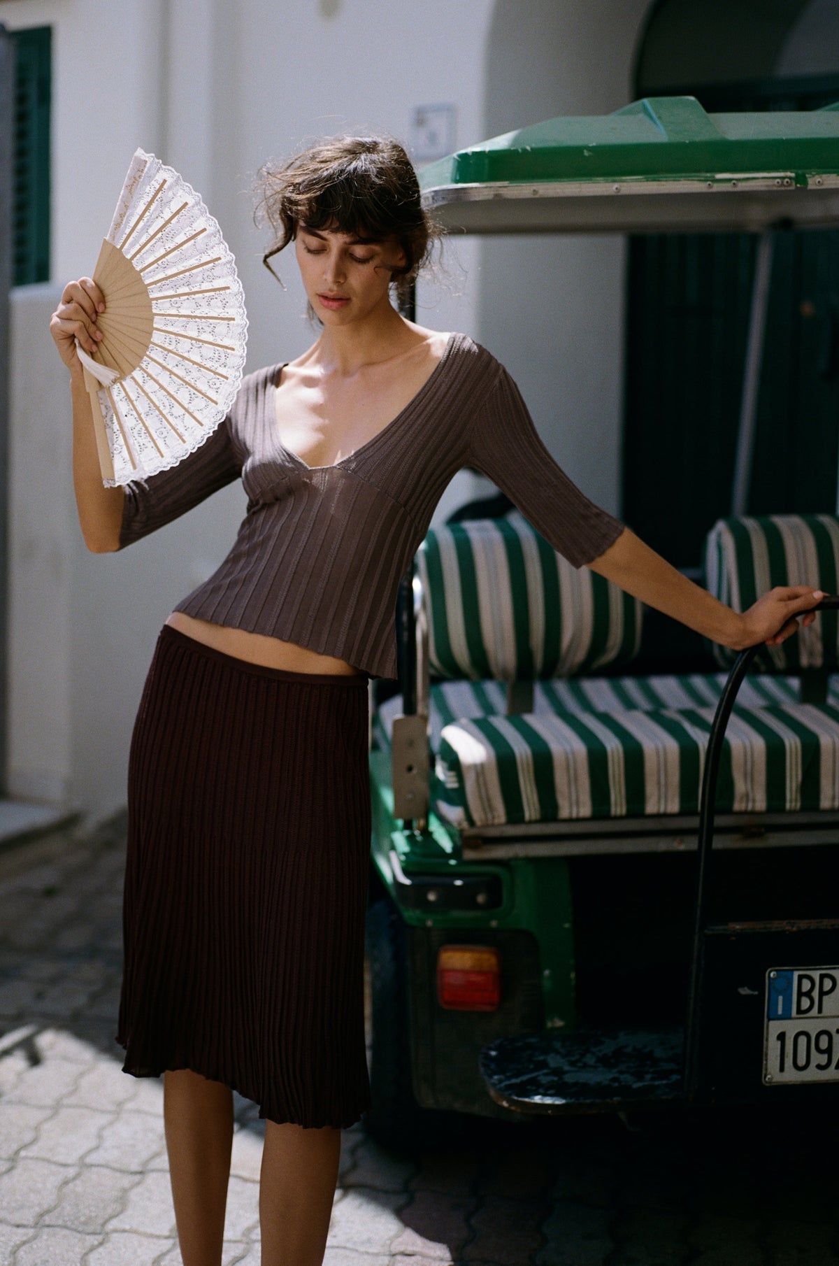 Image of a model wearing Skirts. Product name - Veda Skirt in Chocolate colour by brand - With Jéan