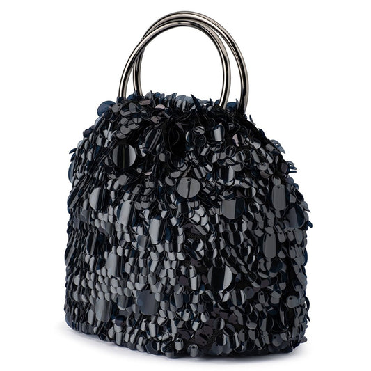 Image of a model wearing Tops. Productname: VERA Sequin Top Handle in colour by brand - Olga Berg