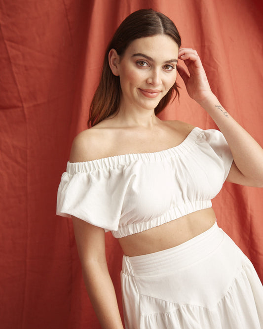Image of a model wearing Tops. Productname: HEYCHIC Vienna Off Shoulder Top in White colour by brand - HEYCHIC