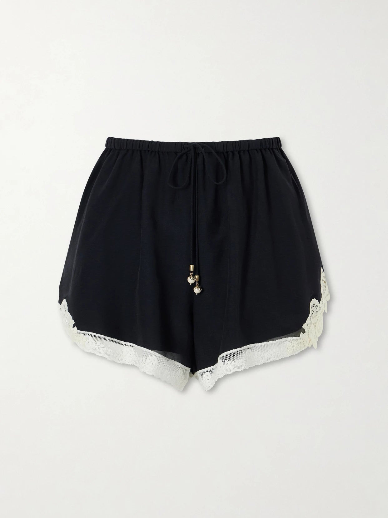 Image of a model wearing Shorts. Product name - Roselight Lace-trimmed Cotton And Silk-blend Shorts in Black colour by brand - Zimmermann