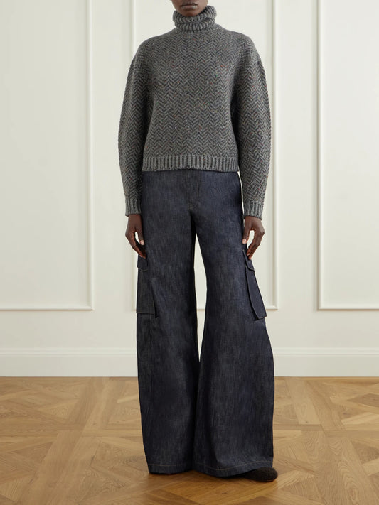 Image of a model wearing Outerwear. Product name - Courtney Herringbone Cashmere Turtleneck Sweater in Gray colour by brand - Gabriela Hearst