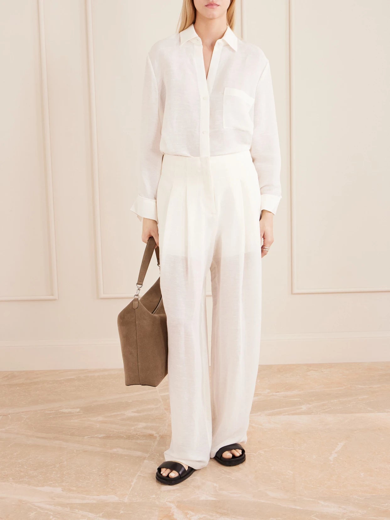 Image of a model wearing Pants. Product name - Carries Linen And Silk-blend Wide-leg Pants in Ivory colour by brand - TWP