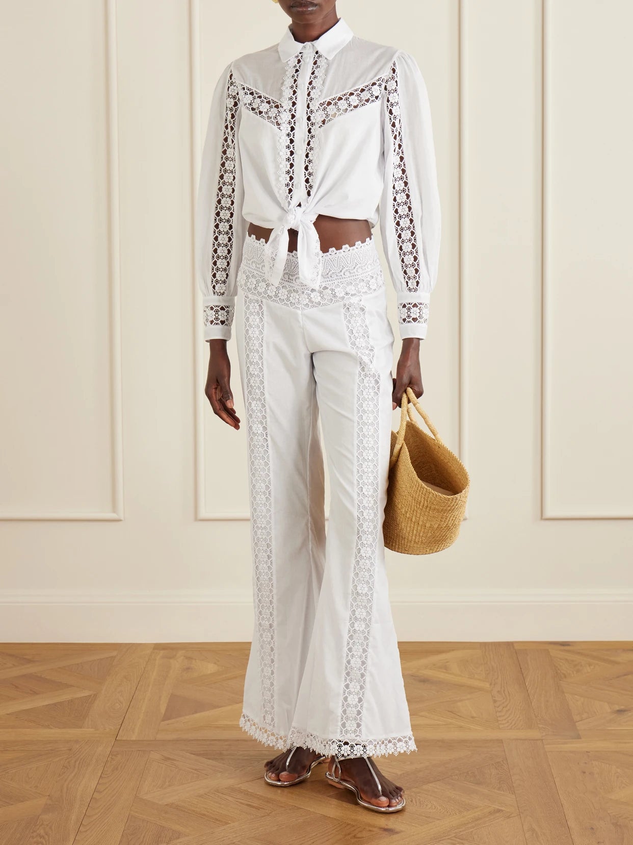 Image of a model wearing Pants. Product name - Vianora Cotton-blend Wide-leg Pants in White colour by brand - Charo Ruiz