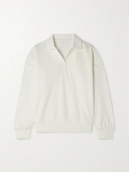 Image of a model wearing Outerwear. Product name - Essentials Corzas Cotton-terry Polo Top in Cream colour by brand - The Row